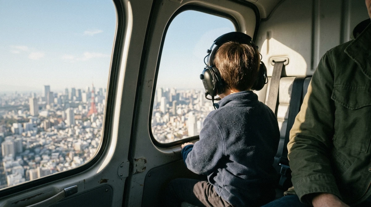 A child wearing a headset and looking out the window during a Tokyo helicopter tour with kids over Tokyo Bay