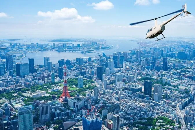 A helicopter cruising high above central Tokyo's skyline and skyscrapers on a Tokyo helicopter tour