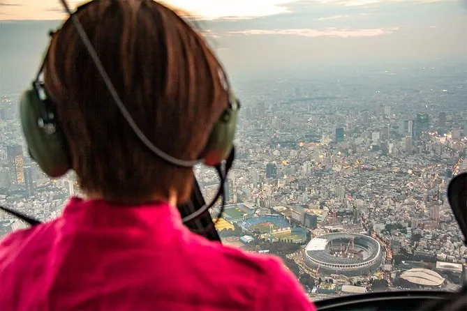 Helicopter passing over Asakusa and the Tokyo Skytree at golden hour on a private Tokyo helicopter tour