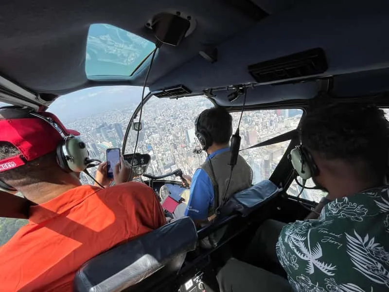 Passengers boarding a helicopter for a Tokyo helicopter tour with hotel pickup and drop-off
